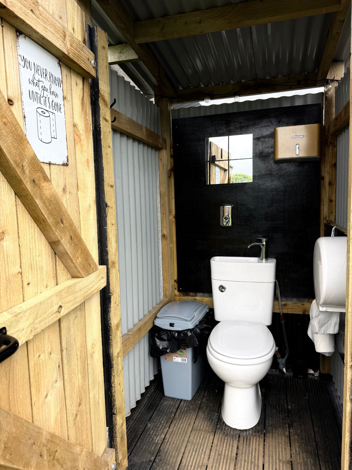 One of the toilet cubicles in the shower and toilet block at Coast and Castles